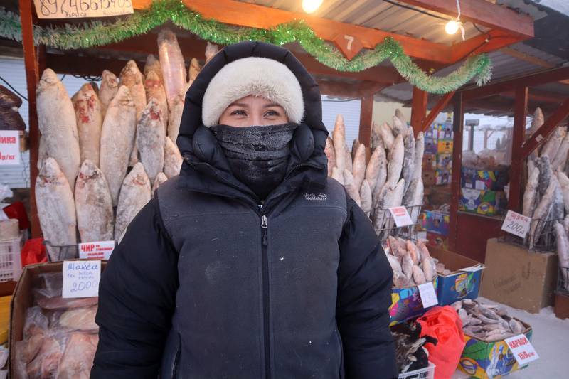Alyona Zaitseva is wrapped up warm and set to greet her customers. Reuters