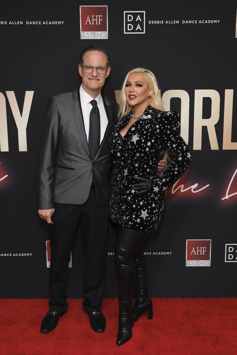 AHF President, Michael Weinstein and Christina Aguilera, wearing a Balmain star-print blazer over leather trousers, attend the at the Aids Healthcare Foundation's concert marking World Aids Day in Inglewood, California on Wednesday, December 1, 2021. AP