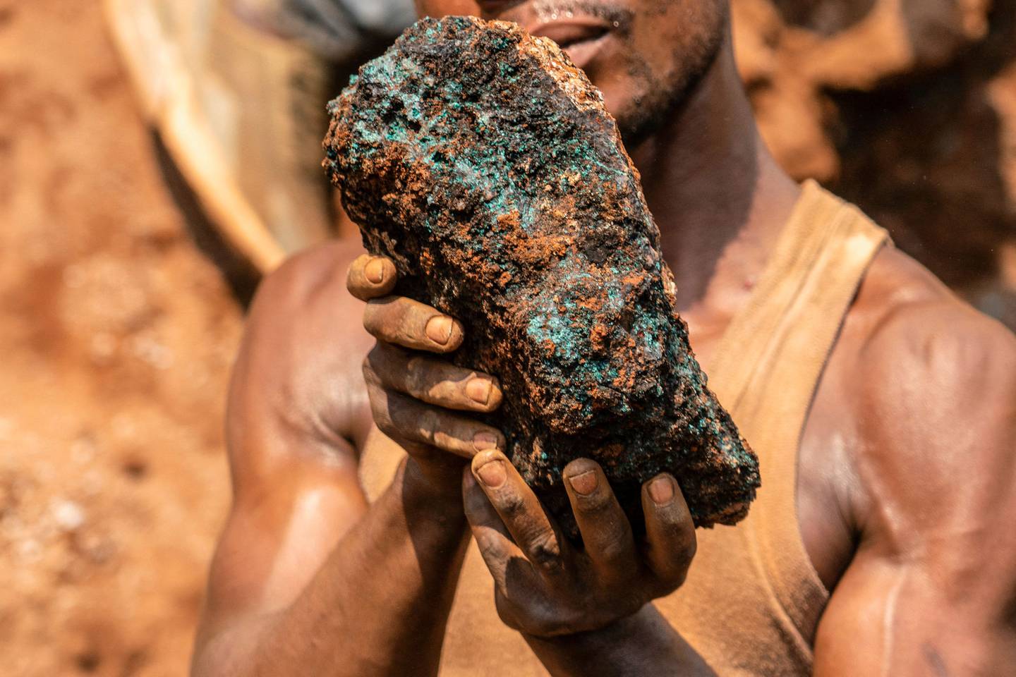 A miner with a cobalt stone near Kolwezi, Congo, on October 12. Congo produced 72 per cent of the world’s cobalt last year. Demand is exploding due to themetal's use in rechargeable batteries that power mobile phones and electric cars. AFP