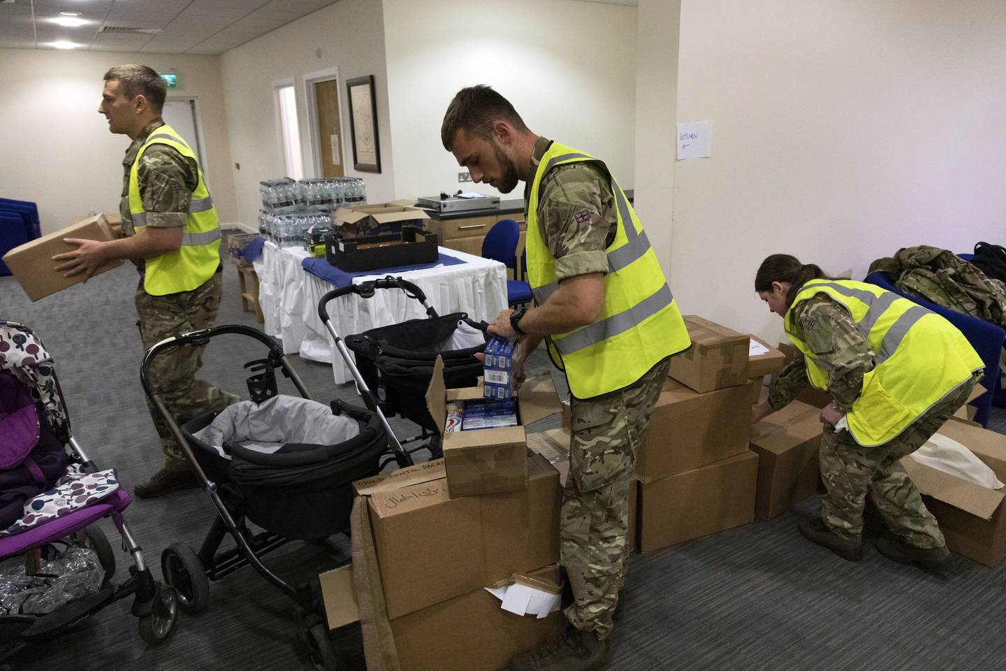 UK mjilitary personnel pack necessities for Afghan nationals arriving at RAF Brize Norton, England. AP 