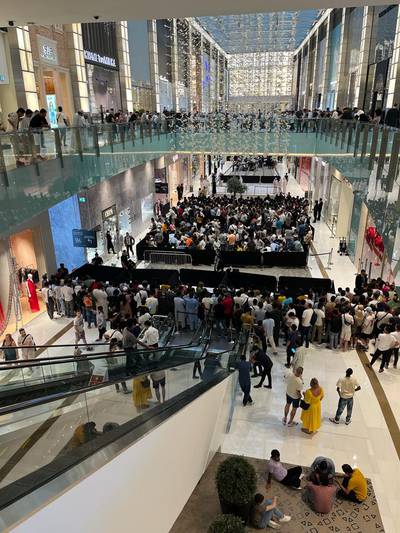 People queue for the iPhone 15 at Dubai Mall in Dubai. John Dennehy / The National