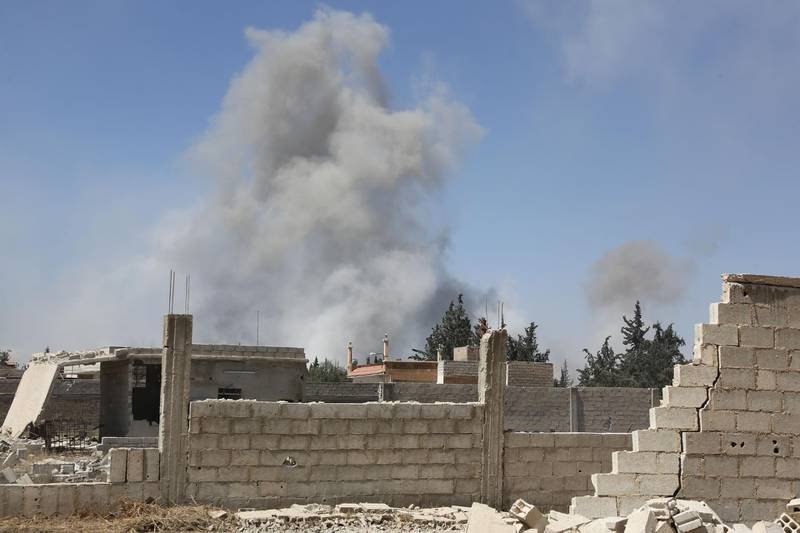 Smoke billows in the town of Douma, the last opposition holdout in Syria's Eastern Ghouta, on April 7, 2018, after Syrian regime troops resumed a military blitz to pressure rebels to withdraw.  AFP