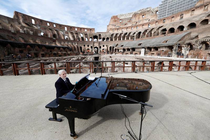 A pianist rehearses ahead of a concert at the Colosseum, as it reopens after the coronavirus restrictions were eased in the Lazio region, Rome, Italy. Reuters
