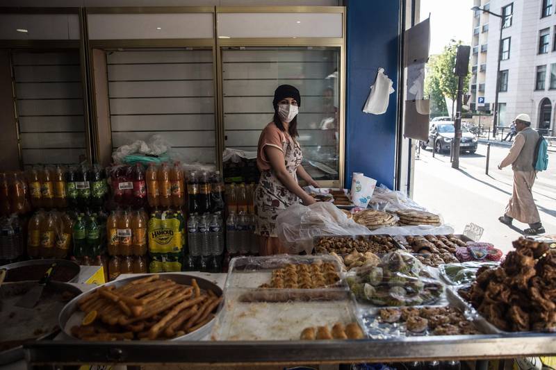An Algerian shopkeeper with a face mask sells pastry before Iftar time in an Arabic market in Porte de Montreuil area in Paris, France. The majority of the residents around Porte de Montreuil area in Paris are Arab Muslims from North Africa, adherents of Islam across France were unable to take part in the habitual collective prayers this year, as mosques have closed down due to the ongoing pandemic of the COVID-19 disease caused by the SARS-CoV-2 coronavirus. Muslims around the world celebrate the holy month of Ramadan by praying during the night time and abstaining from eating, drinking, and engaging in sexual acts between sunrise and sunset. Ramadan is the ninth month in the Islamic calendar and it is believed that the revelation of the first verse in the Koran occurred during its last 10 nights.  EPA