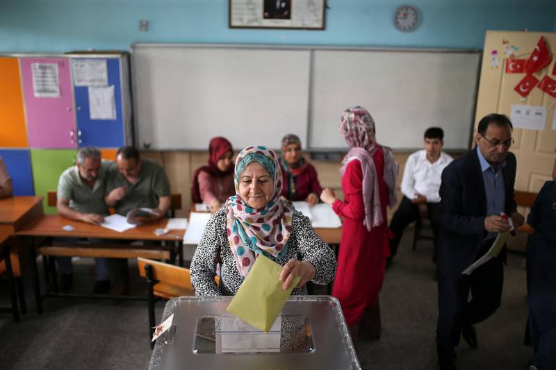 A woman casts her ballot for Turkey's elections at a polling station in the mainly-Kurdish city of Diyarbakir, Turkey, on June 24, 2018.  Emre Tazegul / AP Photo