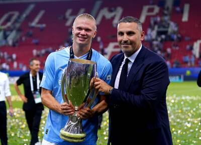 Manchester City chairman Khaldoon Al Mubarak and Erling Haaland with the Super Cup trophy. PA
