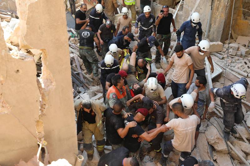 A survivor is taken out of the rubble after a massive explosion in Beirut. AP Photo