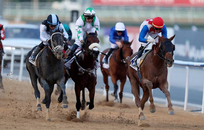 DUBAI , UNITED ARAB EMIRATES , MARCH 30  – 2018 :- Plus Que Parfait ( USA   ) ridden by Jose Ortiz ( no 4 red cap  ) won the 5th horse race UAE Derby 1900m dirt  during the Dubai World Cup held at Meydan Racecourse in Dubai. ( Pawan Singh / The National ) For News/Sports/Instagram/Big Picture. Story by Amith/Rupert