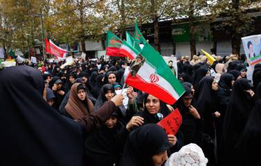 Iranian women take part during a funeral ceremony of Revolutionary Guard member Morteza Ebrahimi who was killed during the protests last week. EPA