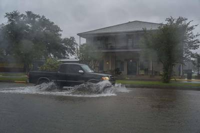 A pickup truck drives through flooded road as Hurricane Delta approaches in Lake Arthur, Louisiana. AFP