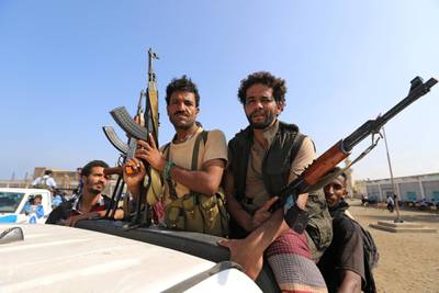 FILE PHOTO: Houthi militants ride on the back of a truck as they withdraw, as part of a U.N.-sponsored peace agreement signed in Sweden earlier this month, from the Red Sea city of Hodeidah, Yemen December 29, 2018. REUTERS/Abduljabbar Zeyad/File Photo