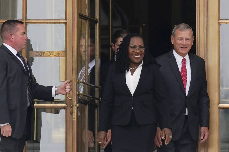 Ms Brown Jackson and Mr Roberts after her formal investiture ceremony at the Supreme Court in Washington. AP