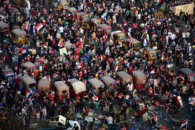 Iraqi protesters gather during a protest at al-Tahrir square, central Baghdad, Iraq.  EPA