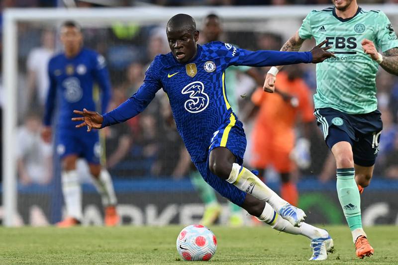 Chelsea's French midfielder N'Golo Kante runs with the ball during the English Premier League football match between Chelsea and Leicester City at Stamford Bridge in London on May 19, 2022.  (Photo by Glyn KIRK / AFP) / RESTRICTED TO EDITORIAL USE.  No use with unauthorized audio, video, data, fixture lists, club/league logos or 'live' services.  Online in-match use limited to 120 images.  An additional 40 images may be used in extra time.  No video emulation.  Social media in-match use limited to 120 images.  An additional 40 images may be used in extra time.  No use in betting publications, games or single club/league/player publications.   /  