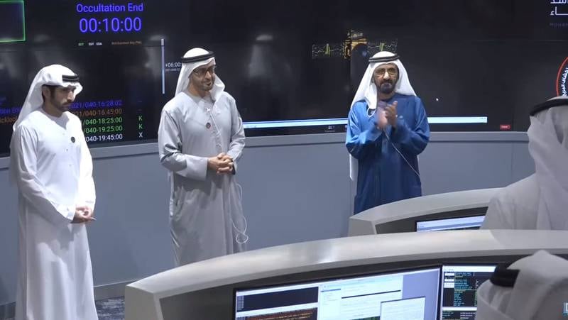 Sheikh Mohammed bin Rashid, Vice President and Ruler of Dubai, right, and Sheikh Mohamed bin Zayed, Crown Prince of Abu Dhabi and Deputy Supreme Commander of the Armed Forces, centre, congratulate the UAE Mars Mission team responsible for sending the Hope probe to the Red Planet on February 10.