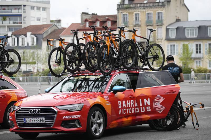 A Bahrain Victorious team mechanic prepares the riders' bicycles prior to the 18th stage of the Tour de France.