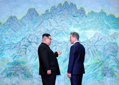 The leaders on discussion. Korea Summit Press Pool via AP