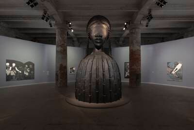 Simone Leigh's sculpture of an eyeless African-American woman, surrounded by Cuban artist Belkis Ayon's prints of a secret Afro-Cuban society in the main exhibition The Milk of Dreams. Photo: Roberto Marossi