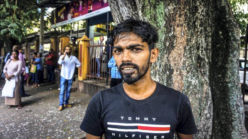 Rajan Wijesena, 29, waiting for relatives outside the National Hospital in Colombo, Sri Lanka, April 22, 2019. Jack Moore / The National. 
