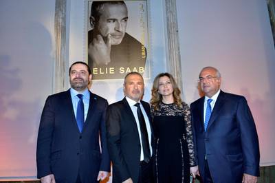epa06636125 Lebanese Prime Minister Saad Hariri (L), Lebanese fashion designer Elie Saab (2-L) and his wife Claudine Saab (2-R) and Khalil Daoud, LibanPost's Chairman and Managing Director (R) pose for photographers during the unveiling ceremony of new stamps with the image of Lebanese fashion designer Elie Saab 'Elie Saab-Le Timbre' in Beirut, Lebanon, 29 March 2018. LibanPost launched the latest edition in its series of collectable stamps, honoring Lebanese fashion designer Elie Saab 'Elie Saab-Le Timbre' under the patronage of the President of the Council of Ministers Saad Hariri.  EPA-EFE/WAEL HAMZEH *** Local Caption *** 54230944