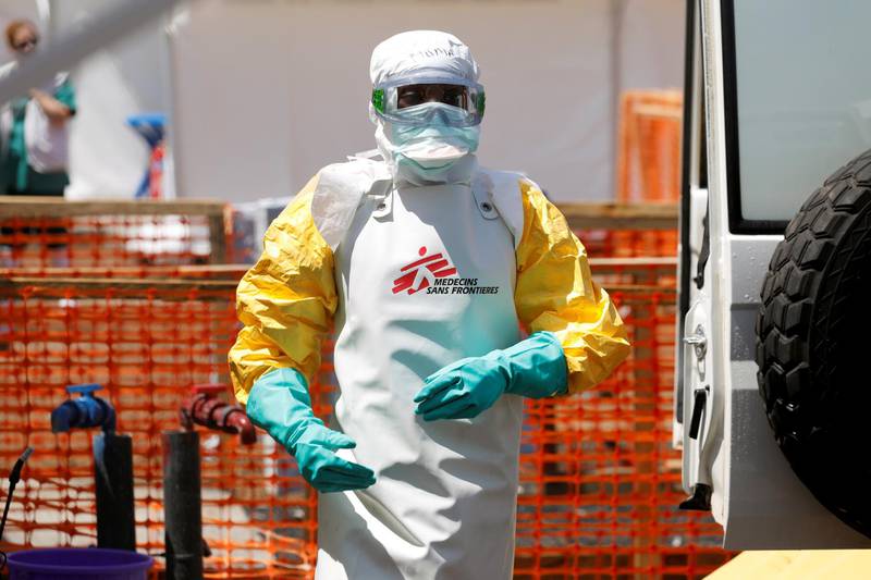 A health worker dressed in protective suit disinfects an ambulance transporting a suspected Ebola patient to the newly constructed MSF (Doctors Without Borders) Ebola treatment centre in Goma, Democratic Republic of Congo, August 4, 2019.REUTERS/Baz Ratner