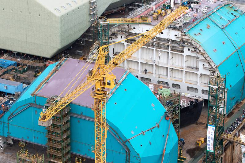 Sections of a ship stand under construction at the Hyundai Heavy Industries shipyard.