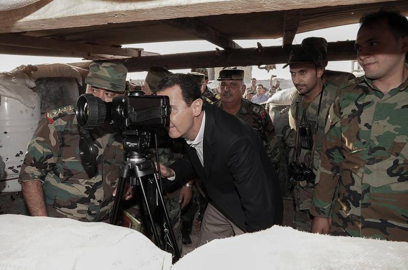 Handout photos made available by the official Syrian Arab News Agency (Sana) shows Syrian President Bashar Al Assad meeting with Syrian regime army personnel in the Idlib countryside. EPA