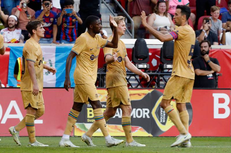 Ousmane Dembele celebrates with teammates after scoring for Barcelona against New York Red Bulls. AFP