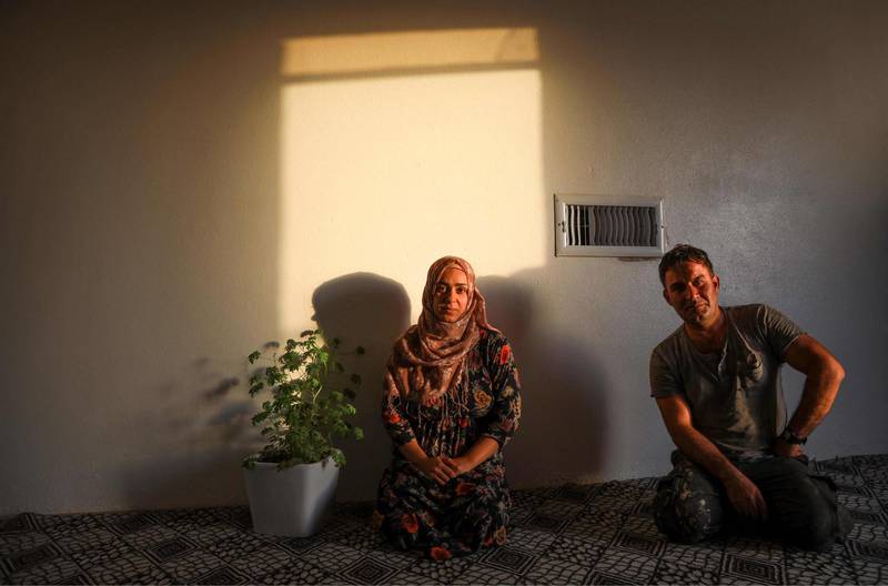 Sawen Goran Zada, 29, an Iranian Kurd refugee, sits with her husband at Bahrka refugee camp. Residents say economic and political hardships make life there very difficult. AFP