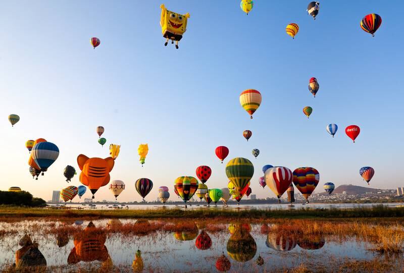 Participants in the International Balloon Festival in Leon, Mexico, lift off. EPA