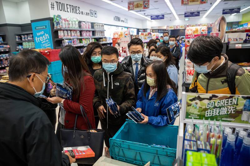 People line up in a Watson store to buy face masks in Central District, Hong Kong, China.  EPA