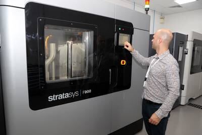 Pavels Senivs, production manager, shows off a 3D printing machine at the Paradigm 3D plant in Dubai. All photos: Pawan Singh / The National