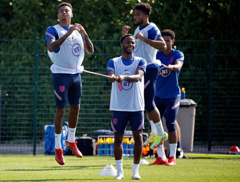 England midfielders Jesse Lingard and Raheem Sterling attend a training session at Hotspur Way. AFP