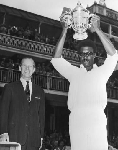 West Indies captain Clive Lloyd raises the inaugural ODI World Cup trophy after his team defeated Australia at Lord's in 1975. Getty