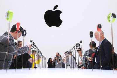 Attendees look at a display of the new Apple Watch during an Apple special event at the Flint Center for the Performing Arts on September 9, 2014 in Cupertino, California. Apple unveiled the Apple Watch wearable tech and two new iPhones, the iPhone 6 and iPhone 6 Plus. Justin Sullivan / Getty Images / AFP