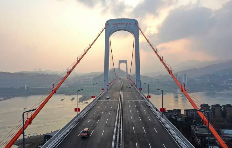 The Guojiatuo Yangtze River Bridge in south-west China.  The 1,403m bridge was opened to traffic on Wednesday.   EPA