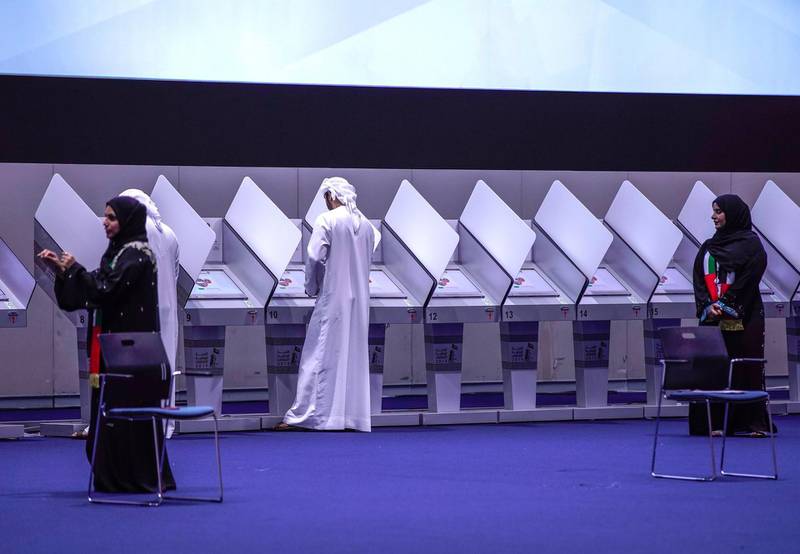 Abu Dhabi, United Arab Emirates, October 5, 2019.  FNC Elections at ADNEC. -- FNC volunteer organizers stand ready to assist voters at the floor.Victor Besa / The NationalSection:  NAReporter:  Haneen Dajani