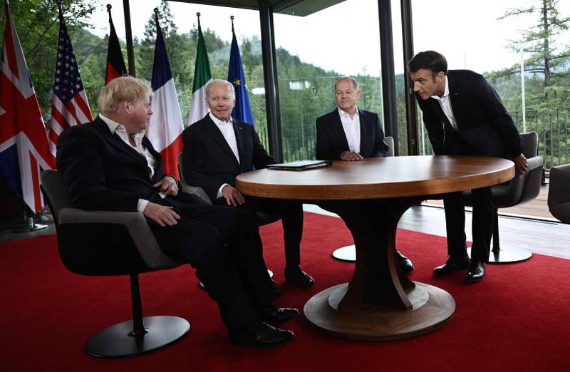 (L-R) Britain's Prime Minister Boris Johnson, US President Joe Biden, German Chancellor Olaf Scholz, France's President Emmanuel Macron take their seats to attend a meeting of five G7 leaders on June 28, 2022 at Elmau Castle, southern Germany, on the last day of the G7 Summit.  (Photo by Brendan SMIALOWSKI  /  AFP)