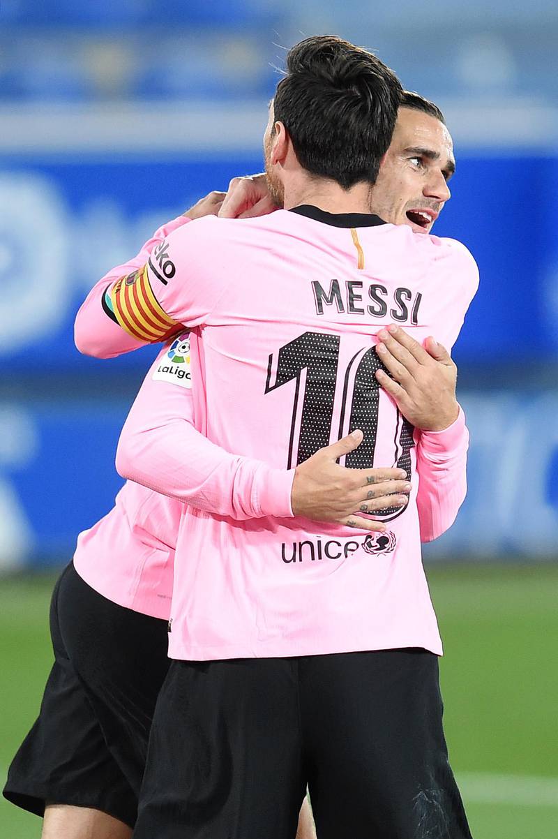 Antoine Griezmann celebrates with Lionel Messi after levelling the scores. Getty