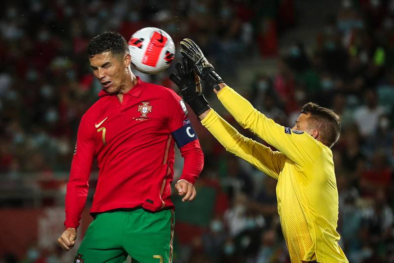 Portugal forward Cristiano Ronaldo vies with Luxembourg goalkeeper Anthony Moris. AFP