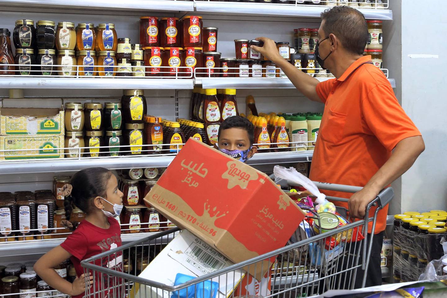 Members of a family shop at a supermarket in Libya's capital Tripoli. AFP