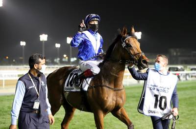 DUBAI , UNITED ARAB EMIRATES , MARCH 27  – 2021 :-  LORD NORTH  (IRE) ridden by LANFRANCO DETTORI ( no 10  ) won the 7th  horse race Dubai Turf 1800m Turf  during the Dubai World Cup held at Meydan Racecourse in Dubai. ( Pawan Singh / The National ) For News/Sports/Instagram/Big Picture. Story by Amith