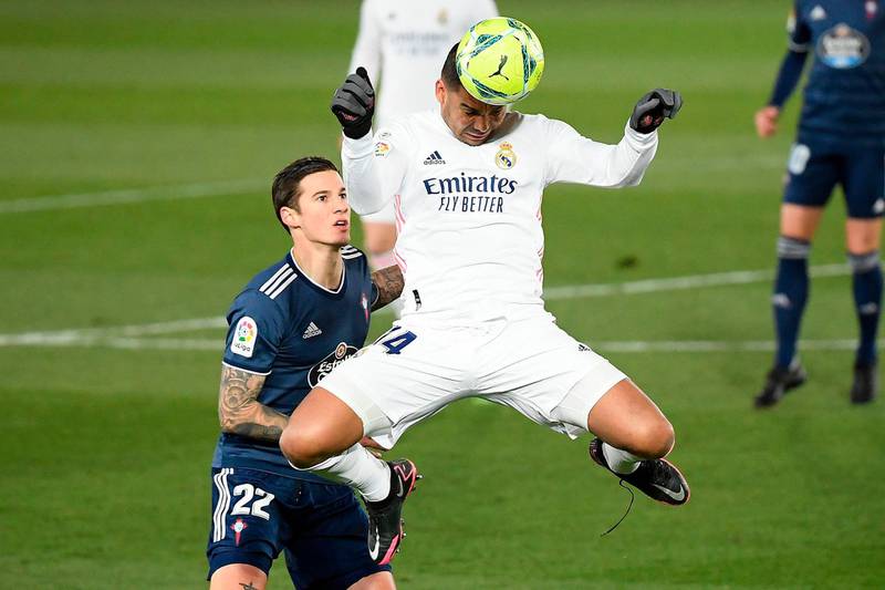Real Madrid midfielder Casemiro heads the ball. AFP