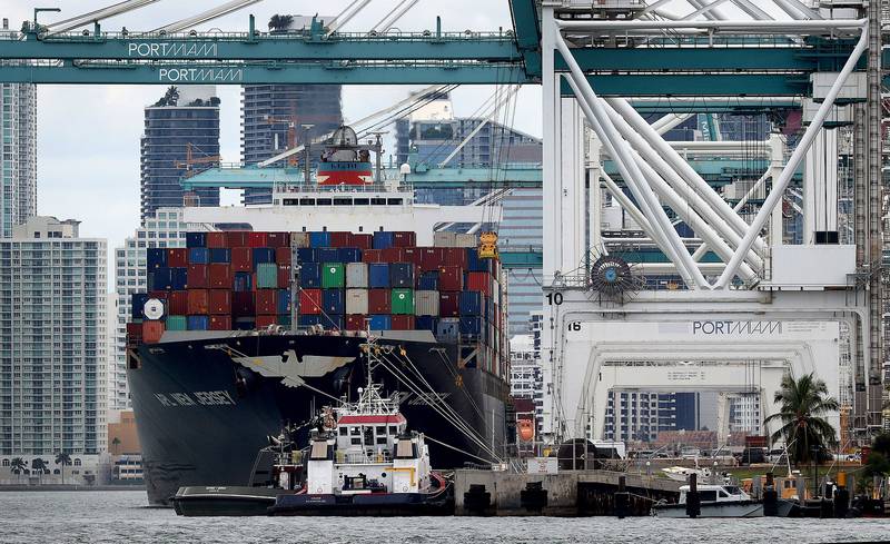 A cargo ship is offloaded at Port Miami in Florida. Current policy frameworks will leave the industry short of its 2050 net-zero carbon targets, the ICS says. Getty Images