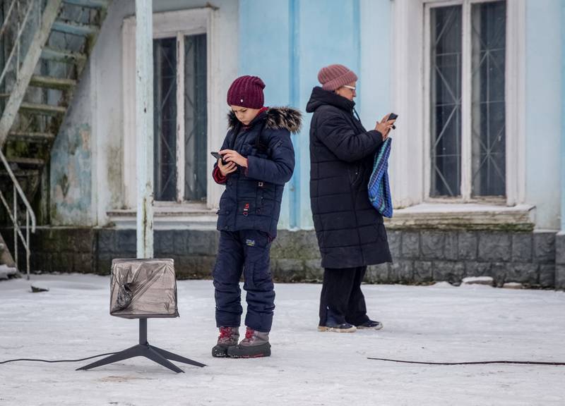 Residents in Ukraine's Donetsk enclave use a Starlink terminal. Reuters