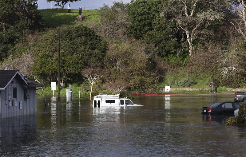 A parking lot in the harbour in Santa Cruz, California, was flooded by a tidal surge caused by the volcanic eruption thousands of kilometres away. AP