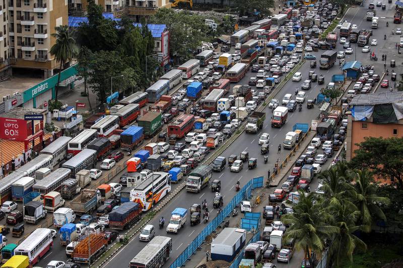 epa08515647 A general view of huge traffic jam on the Western Express Highway as the police strictly enforce a two-km travel restriction for all residents except essential service goers, near Mumbai, India, 29 June 2020. According to media reports, Mumbai Police warned that the vehicles will be impounded if people found plying away from their locality beyond two kilometer of radius without a valid reason. The Indian government has decided to provide relaxation in the ongoing lockdown but it will continue until 30 June, in 'containment zones.'  EPA/DIVYAKANT SOLANKI