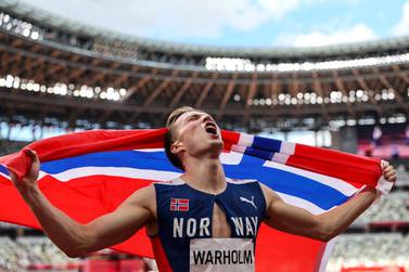 TOKYO, JAPAN - AUGUST 03: Karsten Warholm of Team Norway celebrates winning the gold medal in the Men's 400m Hurdles Final on day eleven of the Tokyo 2020 Olympic Games at Olympic Stadium on August 03, 2021 in Tokyo, Japan. (Photo by Patrick Smith / Getty Images)