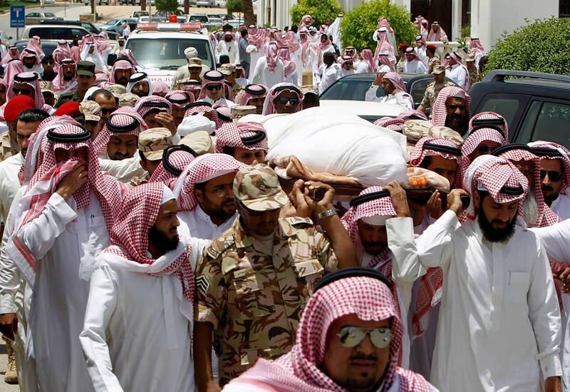 Relatives carry the body of Hassan Al Qahtani outside the Grand Mosque in Riyadh in May 2011. The Saudi diplomat was shot dead in Karachi by a man believed to have been linked to Iran's Islamic Revolutionary Guard Corps' Quds Force. Reuters