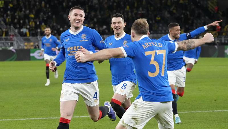 Rangers' John Lundstram, left, celebrates after he scored his side's fourth goal during the Europa League play-off against Borussia Dortmund. AP